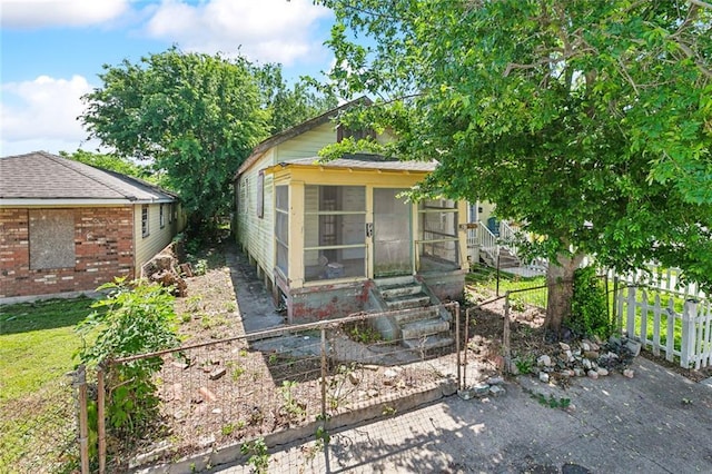 625 Forstall St, New Orleans, LA 70117 - view of outdoor structure featuring a sunroom and fence private yard