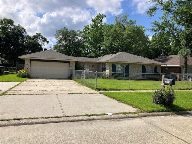 ranch-style home with fence private yard, an attached garage, driveway, and a front lawn