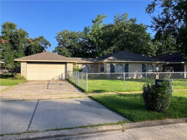 3837 Coventry St, Slidell, LA 70458 - ranch-style house with concrete driveway, a garage, a fenced front yard, and brick siding