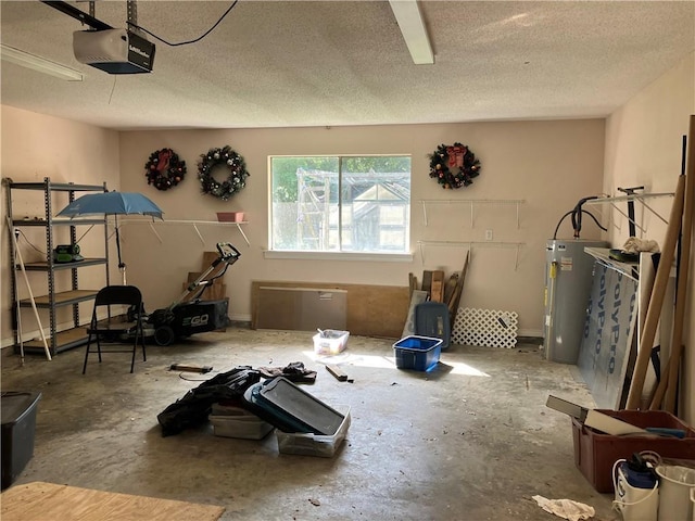 interior space featuring water heater and a textured ceiling