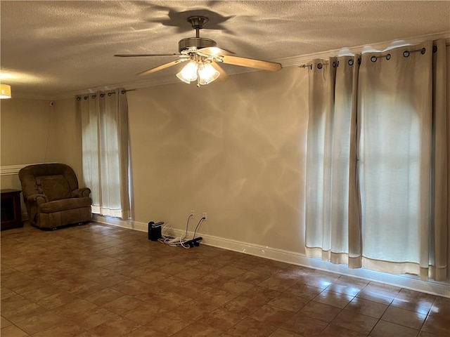 3837 Coventry St, Slidell, LA 70458 - unfurnished living room with a textured ceiling, a ceiling fan, crown molding, and baseboards