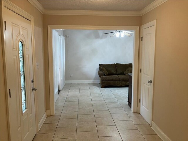 3837 Coventry St, Slidell, LA 70458 - hallway featuring light tile patterned flooring, ornamental molding, and baseboards