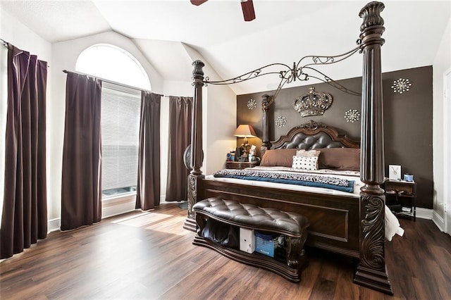 bedroom featuring baseboards, ceiling fan, wood finished floors, and lofted ceiling