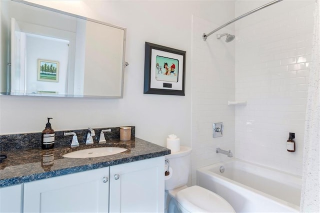 bathroom with toilet, washtub / shower combination, and vanity