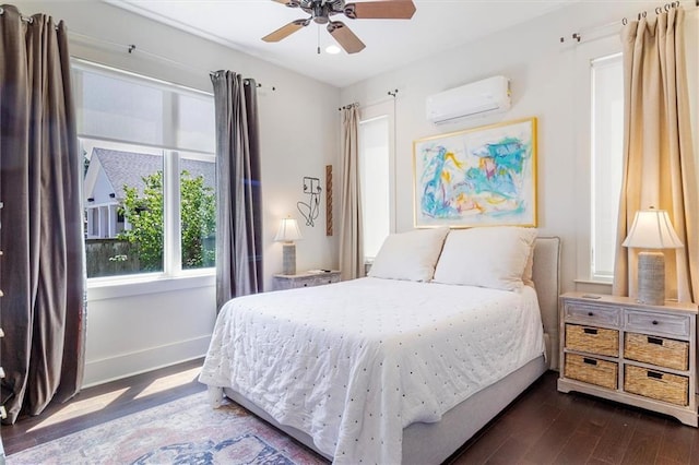 bedroom featuring baseboards, dark wood-type flooring, recessed lighting, a wall unit AC, and a ceiling fan