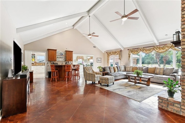 living area with ceiling fan, beam ceiling, and high vaulted ceiling