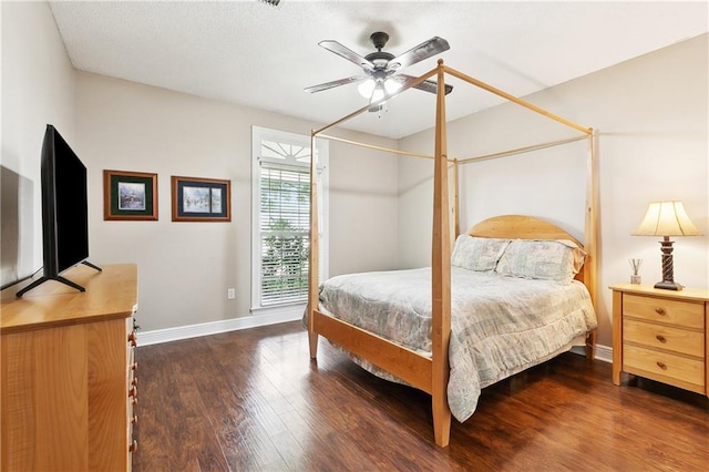 bedroom with baseboards, ceiling fan, and wood finished floors
