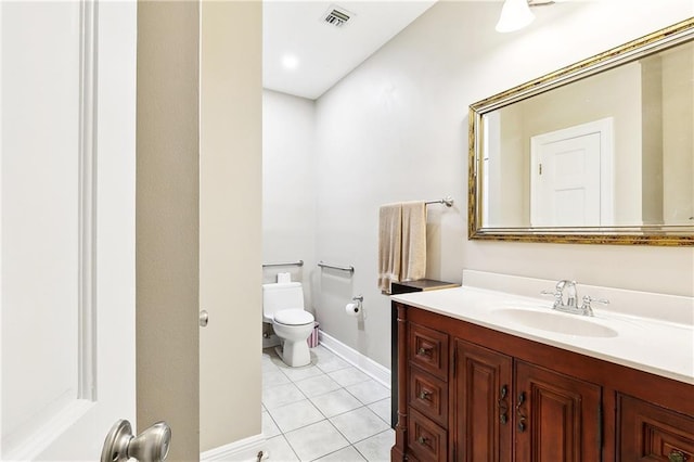 bathroom with visible vents, tile patterned flooring, vanity, baseboards, and toilet