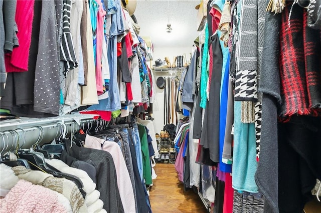 walk in closet featuring wood finished floors