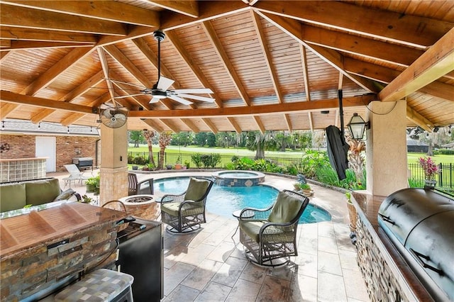 view of patio with area for grilling, a ceiling fan, a pool with connected hot tub, a gazebo, and fence