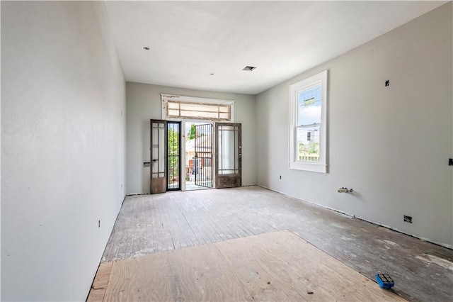 819 N Lopez St, New Orleans, LA 70119 - spare room featuring visible vents and hardwood / wood-style floors