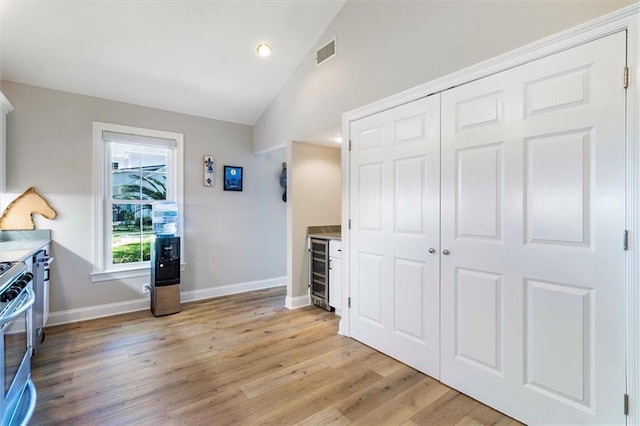 20 Thrasher St, New Orleans, LA 70124 - interior space with baseboards, lofted ceiling, light wood-type flooring, visible vents, and a closet