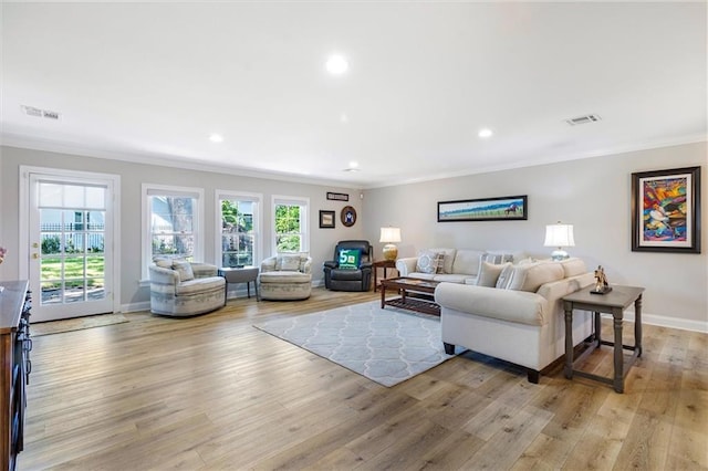 20 Thrasher St, New Orleans, LA 70124 - living room with baseboards, visible vents, ornamental molding, and light wood-style flooring