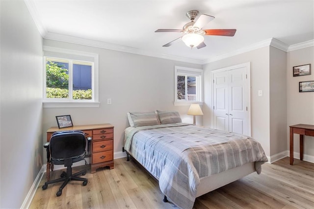 20 Thrasher St, New Orleans, LA 70124 - bedroom featuring crown molding, a ceiling fan, baseboards, and light wood-style flooring