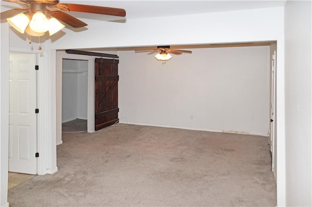 unfurnished bedroom featuring a closet, carpet flooring, and a ceiling fan