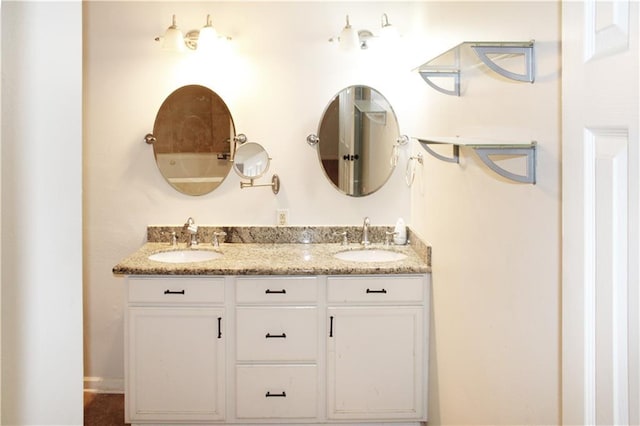 bathroom featuring double vanity and a sink