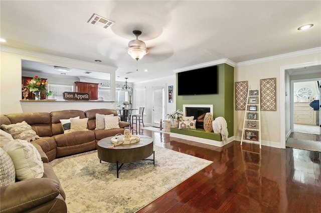 7160 E Renaissance Ct, New Orleans, LA 70128 - living room featuring visible vents, ornamental molding, dark wood finished floors, and a ceiling fan