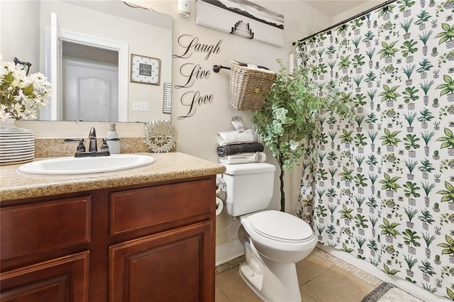 7160 E Renaissance Ct, New Orleans, LA 70128 - bathroom with vanity, a shower with shower curtain, tile patterned flooring, and toilet