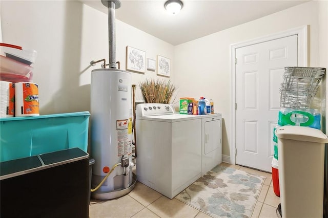7160 E Renaissance Ct, New Orleans, LA 70128 - washroom with laundry area, light tile patterned floors, gas water heater, and washing machine and clothes dryer