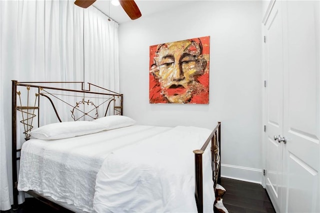 1201 Canal St Unit 416, New Orleans, LA 70112 - bedroom featuring baseboards, a ceiling fan, and wood finished floors