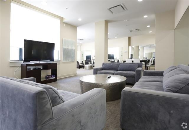 1201 Canal St Unit 416, New Orleans, LA 70112 - living room with carpet floors, recessed lighting, and visible vents