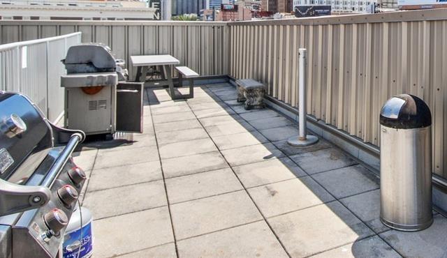 1201 Canal St Unit 416, New Orleans, LA 70112 - view of patio / terrace featuring fence and grilling area