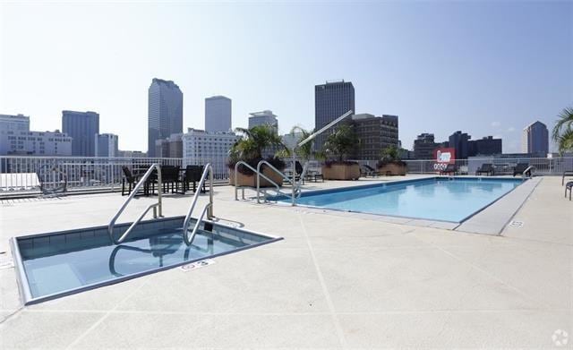 1201 Canal St Unit 416, New Orleans, LA 70112 - community pool featuring a view of city and a patio area