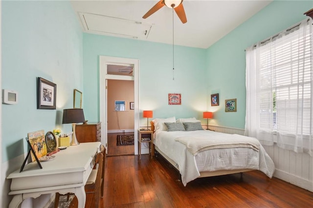 bedroom with ceiling fan and hardwood / wood-style floors