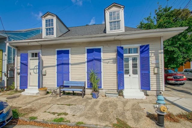 2441 Chartres St, New Orleans, LA 70117 - view of front facade featuring a shingled roof
