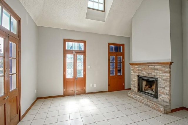 2441 Chartres St, New Orleans, LA 70117 - interior space with vaulted ceiling, baseboards, a brick fireplace, and a textured ceiling