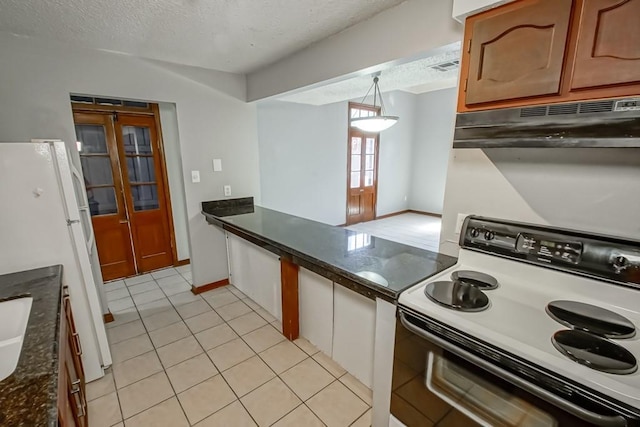 2441 Chartres St, New Orleans, LA 70117 - kitchen featuring freestanding refrigerator, light tile patterned flooring, electric range oven, a textured ceiling, and under cabinet range hood