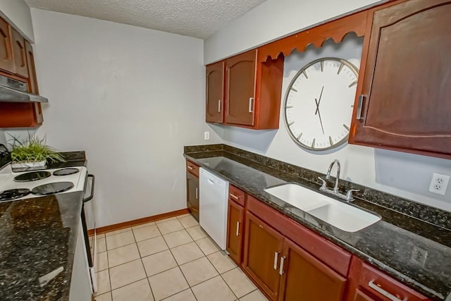 2441 Chartres St, New Orleans, LA 70117 - kitchen with white dishwasher, a textured ceiling, under cabinet range hood, a sink, and dark stone countertops