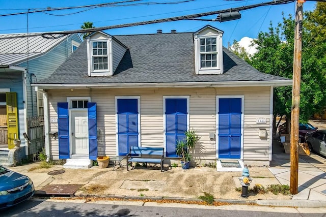 2441 Chartres St, New Orleans, LA 70117 - view of front of home featuring a shingled roof