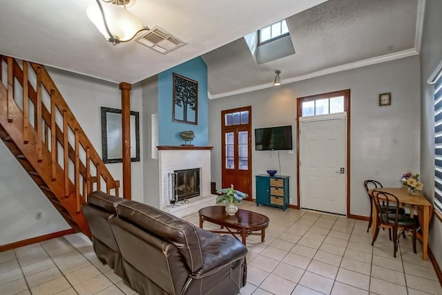 2441 Chartres St, New Orleans, LA 70117 - living room with visible vents, baseboards, and light tile patterned flooring