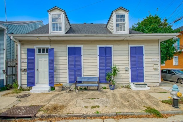 2441 Chartres St, New Orleans, LA 70117 - back of house featuring entry steps and a shingled roof