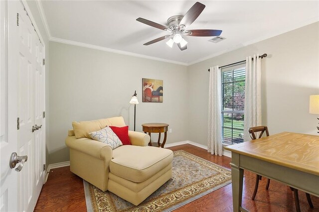 sitting room with baseboards, wood finished floors, ceiling fan, and ornamental molding
