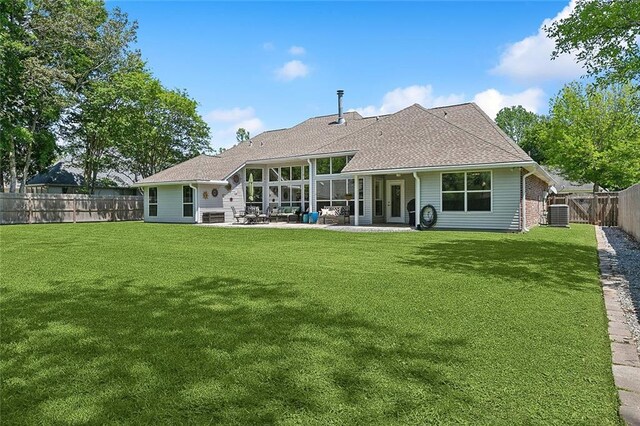 back of house with a patio, a shingled roof, and cooling unit