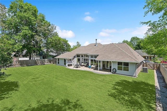 back of property featuring a patio, central air condition unit, and roof with shingles