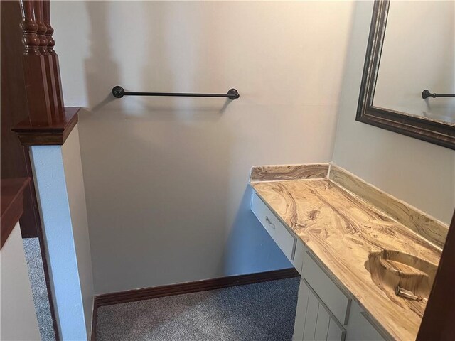 bathroom with vanity and baseboards