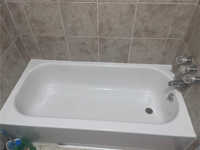 bathroom featuring a bath