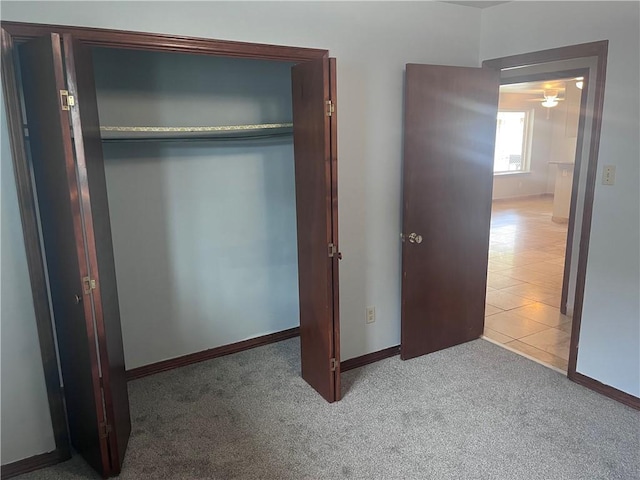 unfurnished bedroom with carpet and baseboards