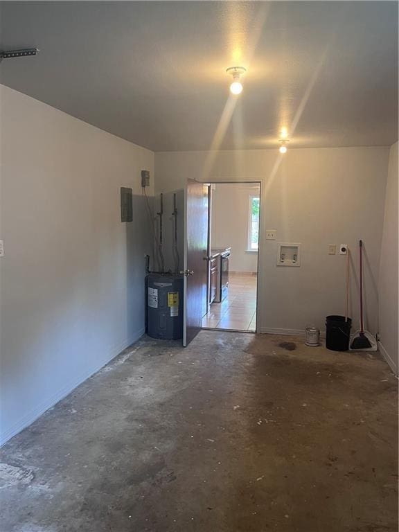 garage with electric water heater and baseboards