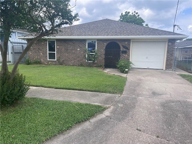 single story home with brick siding, a shingled roof, an attached garage, and driveway