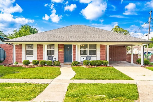 single story home with brick siding, driveway, a front yard, and covered porch
