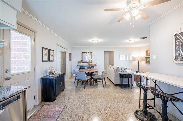 919.5 Perry St, Gretna, LA 70053 - dining area featuring dark aggregate flooring, ceiling fan, and crown molding