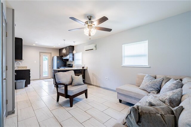 919.5 Perry St, Gretna, LA 70053 - living area featuring a wall mounted air conditioner, a ceiling fan, recessed lighting, and baseboards