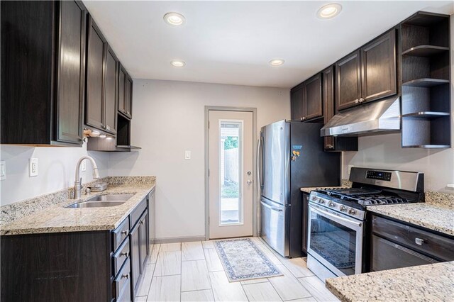919.5 Perry St, Gretna, LA 70053 - kitchen with stainless steel appliances, under cabinet range hood, a sink, open shelves, and dark brown cabinetry