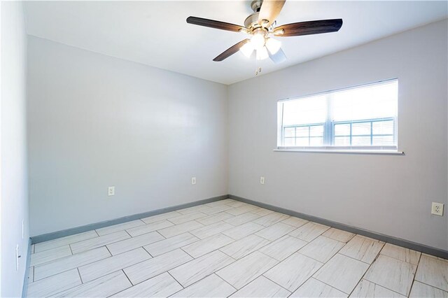 919.5 Perry St, Gretna, LA 70053 - unfurnished room with a ceiling fan and baseboards