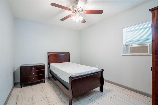 919.5 Perry St, Gretna, LA 70053 - bedroom with cooling unit, baseboards, and a ceiling fan