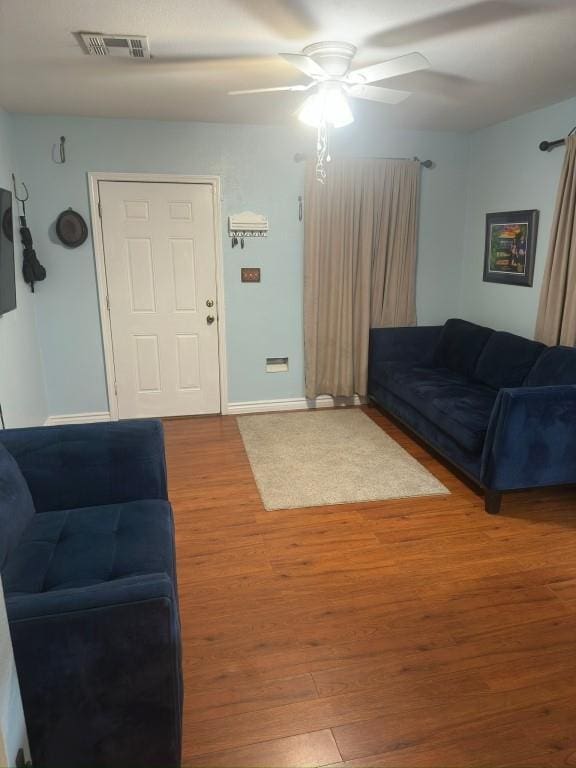 5167 Lafaye St, New Orleans, LA 70122 - living area featuring wood finished floors and a ceiling fan